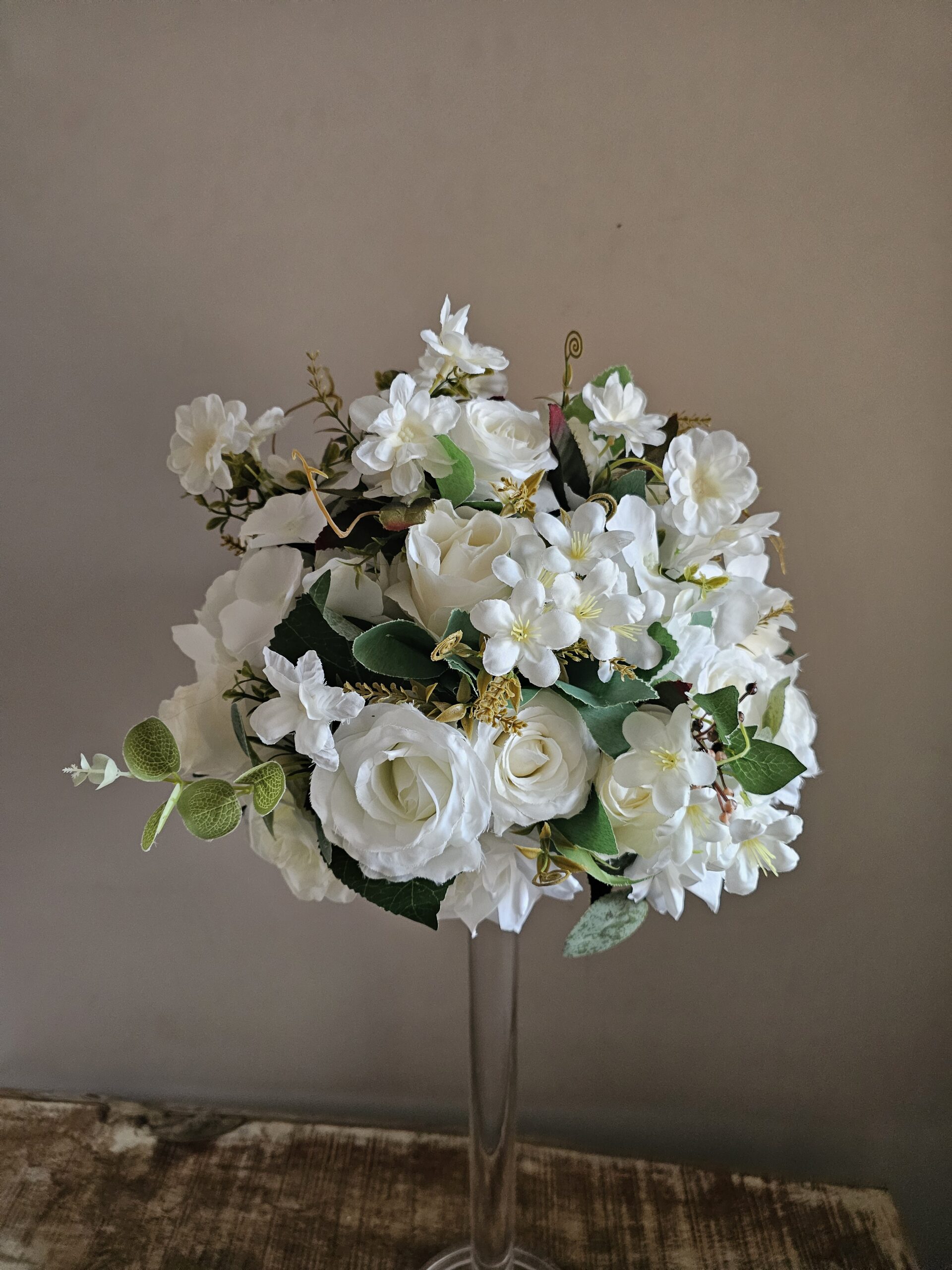 Ivory floral centrepieces with Aryclic stand