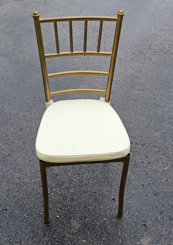 Gold Chivari chairs with ivory Cushions