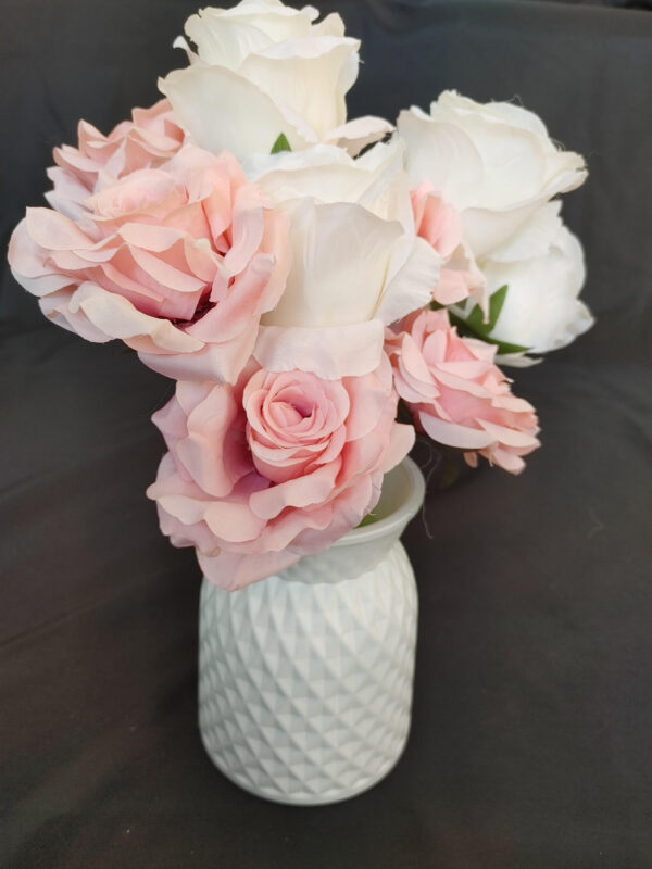White vase with floral arrangements
