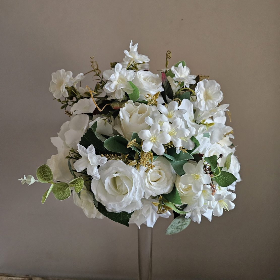 Ivory floral centrepieces with Aryclic stand